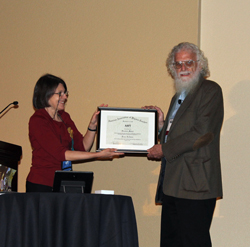 Dean Zollman receives the 2014 Oersted Medal from Jill Marshall, Awards Committee Chair.