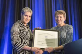 Margaret Wertheim receives the Klopsteg Memorial Lecture Award from AAPT Awards Chair, Mary Mogge