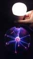 'A Plasma Ball Lighting Up A Light Bulb' by Daniel Robert Klosowski